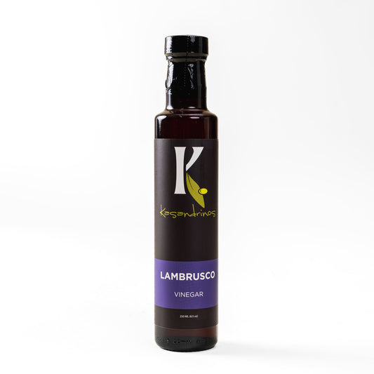 Bottle of Lambrusco vinegar with a black label on a white background